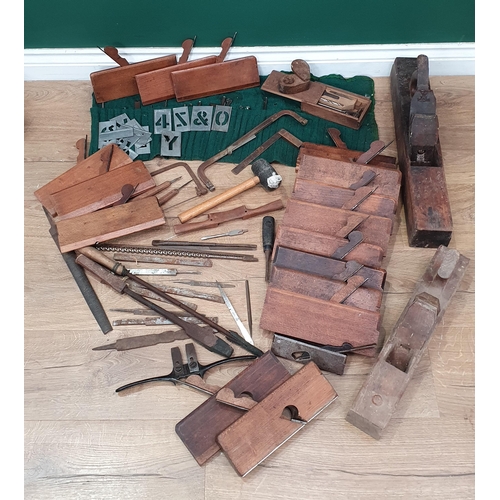 218 - A quantity of Vintage Tools including, Moulding Planes, Stencils, Drill Bits, Chisels, etc.