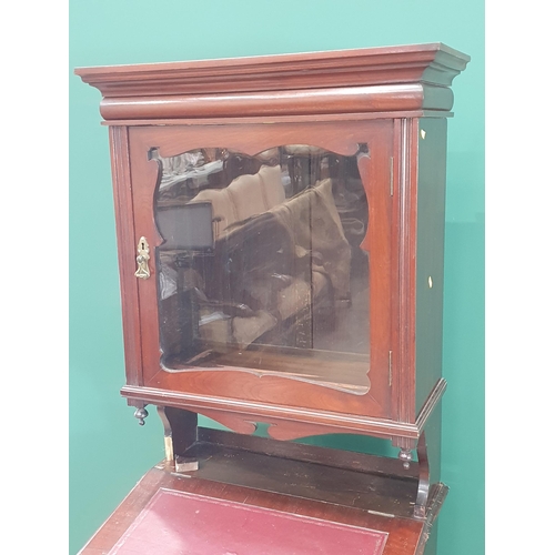 33 - A mahogany Davenport with Cabinet, the cabinet with glazed door above lift up writing surface, with ... 