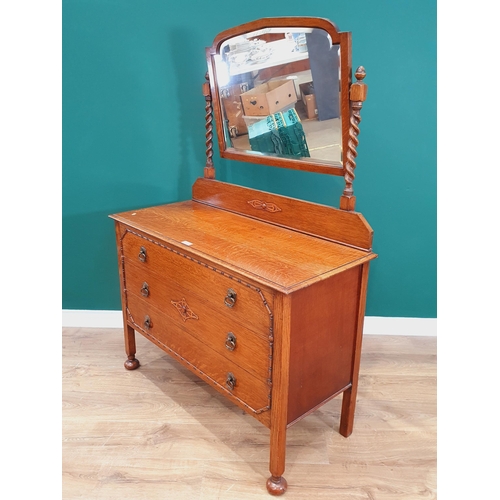 43 - An oak Mirror Back Dressing Chest fitted three long Drawers on square cut supports and bun feet, 5ft... 