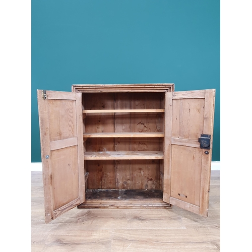 52 - A rustic pine Wall Cupboard with pair of panelled doors enclosing shelved interior, 3ft High x 28