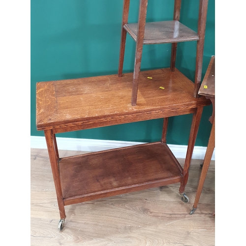 55 - An oak Tea Trolley with fold over card table top, a mahogany and inlaid Writing Table, an oak two ti... 