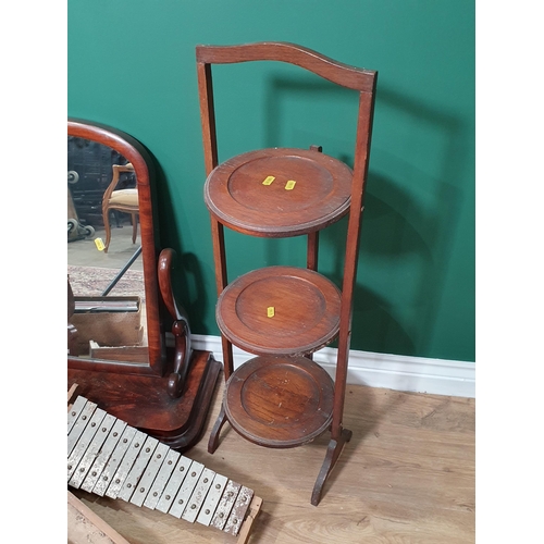 585 - A mahogany swing Dressing Table Mirror on plinth base, another Dressing Mirror, an oak folding Cake ... 