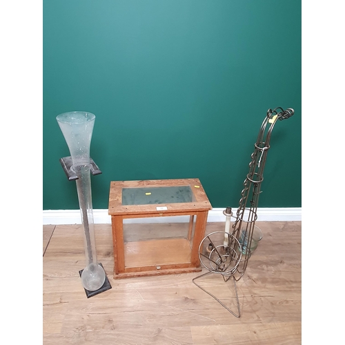 586 - A glazed Scales Cabinet, a Yard of Ale style glass and stand, and a wirework saxophone Candle Holder... 