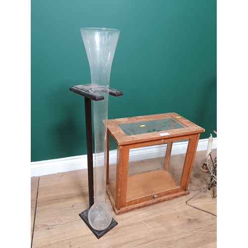 586 - A glazed Scales Cabinet, a Yard of Ale style glass and stand, and a wirework saxophone Candle Holder... 