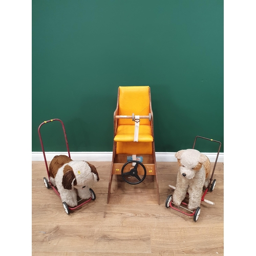 598 - A child's Hokus Pokus 3 in 1 toy and two push-along Dogs