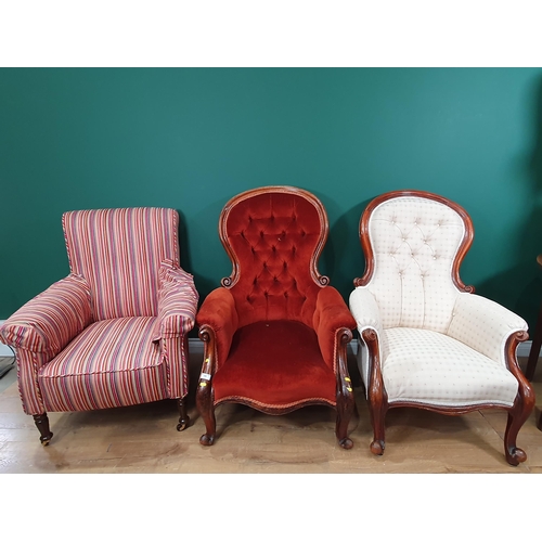 599 - Two Victorian button upholstered spoon back Armchairs, and an Armchair with striped upholstery on tu... 