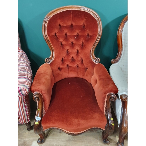 599 - Two Victorian button upholstered spoon back Armchairs, and an Armchair with striped upholstery on tu... 