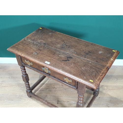 6 - An antique oak Lowboy, with single fitted drawer on bobbin turned supports and square cut stretchers... 