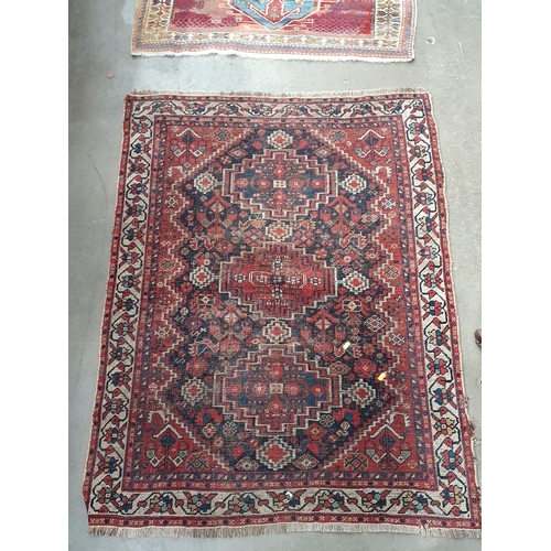 600 - A Kashgai Rug, multi-bordered with central medallions on a red ground, 5ft 10in x 3ft 7in and a Shir... 