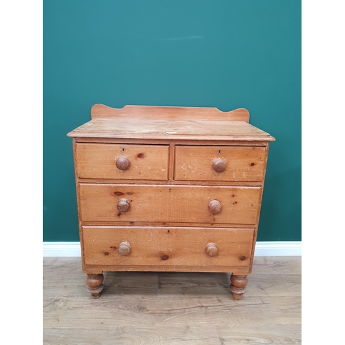 608 - A pine Chest of two short, two long Drawers with shaped gallery back on turned supports, 3ft 3