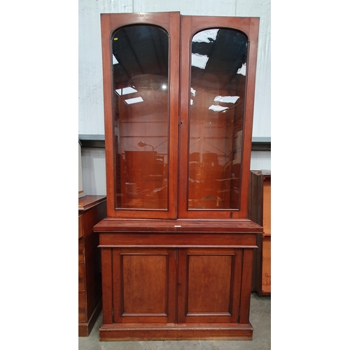 613 - A Victorian mahogany glazed top Bookcase fitted with adjustable shelves, above fitted drawer with pa... 