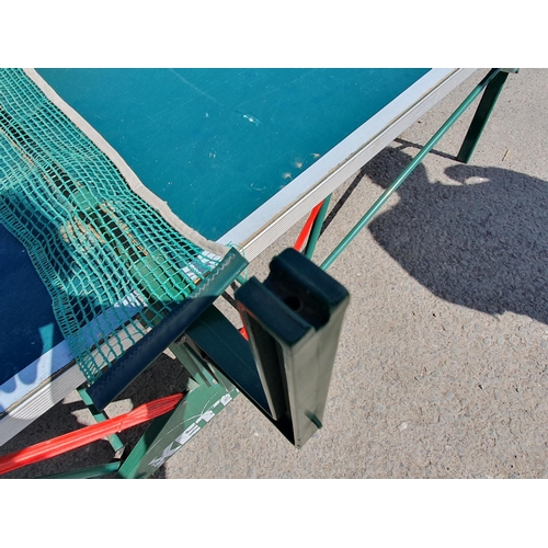 614 - A Kettler folding Table Tennis Table including bats balls and net, A/F and missing one net support