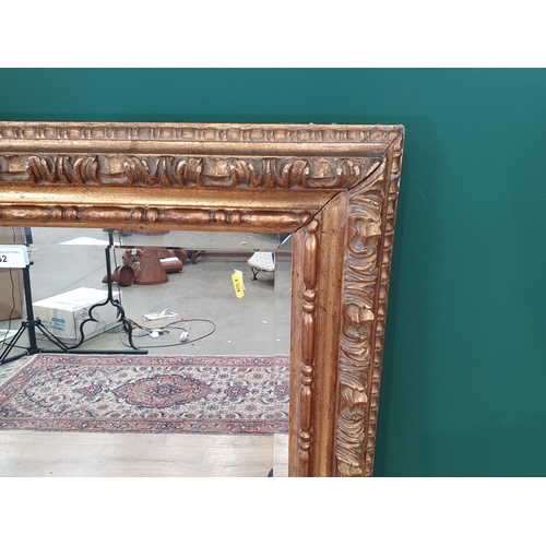 62 - A rectangular carved wood gilt framed Wall Mirror with bevelled plate, 3ft 4