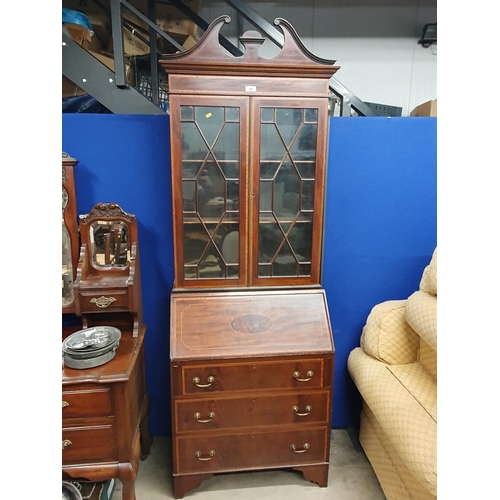 24 - An Edwardian mahogany and crossbanded Bureau Bookcase fitted three drawers to base, 7ft 3