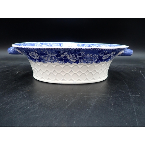 100 - An Adams blue and white oval two-handled Bowl printed 'Cattle Scenery' and floral border