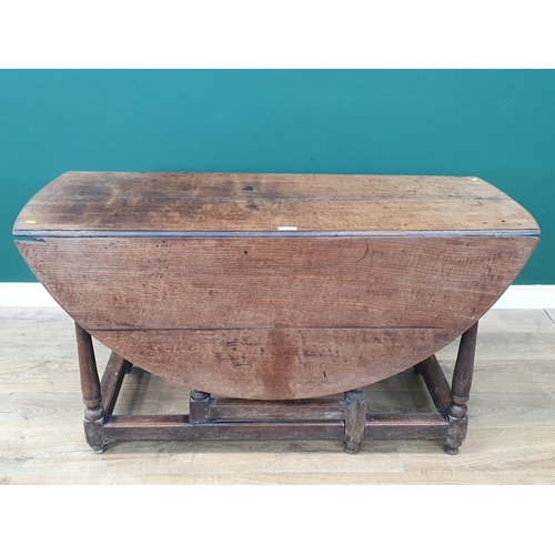 11 - An antique oak Gateleg Table with single fitted drawer on turned and tapered supports, A/F, 4ft 4