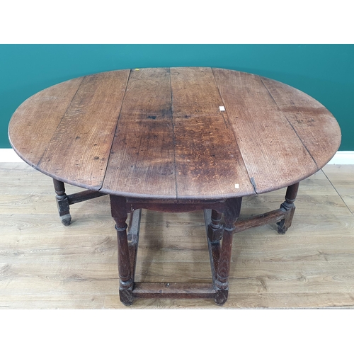 11 - An antique oak Gateleg Table with single fitted drawer on turned and tapered supports, A/F, 4ft 4