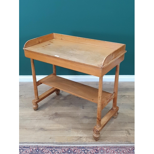 13 - A pine two tier Washstand with raised gallery, on tapered supports and bun feet, 3ft Wide x 2ft 9