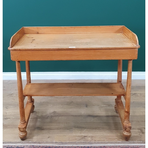 13 - A pine two tier Washstand with raised gallery, on tapered supports and bun feet, 3ft Wide x 2ft 9