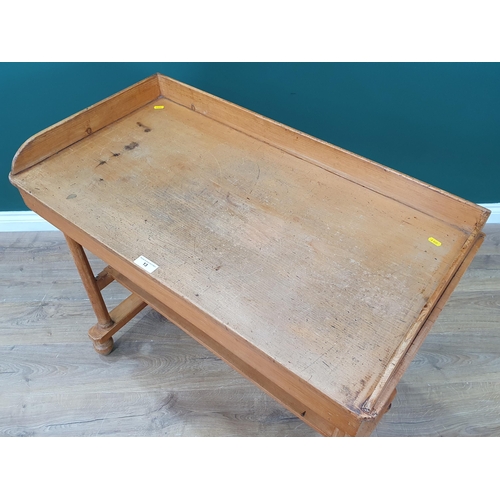 13 - A pine two tier Washstand with raised gallery, on tapered supports and bun feet, 3ft Wide x 2ft 9