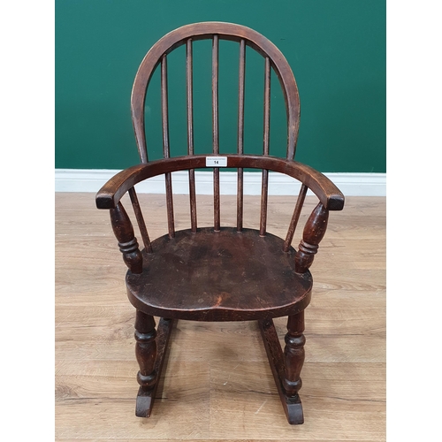 14 - An oak Childs Rocking Chair on turned supports A/F.