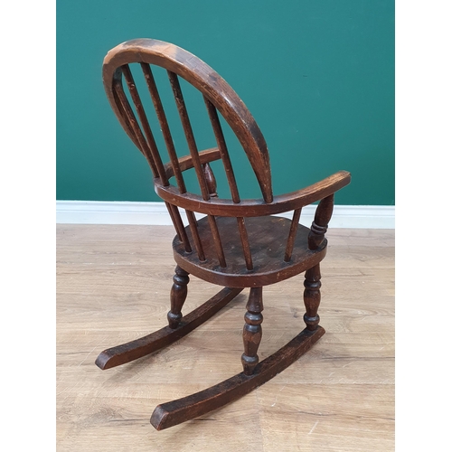 14 - An oak Childs Rocking Chair on turned supports A/F.