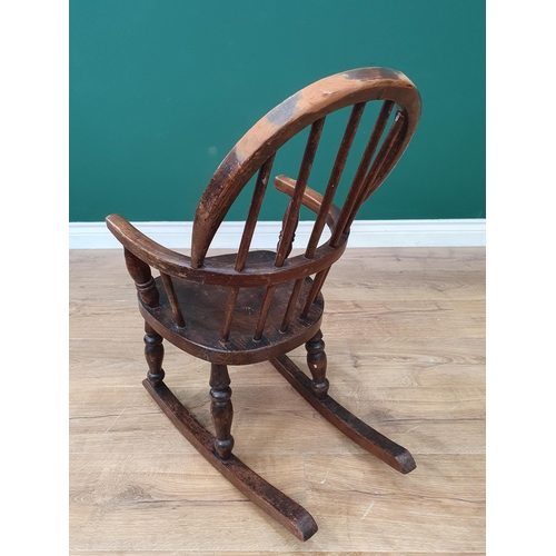 14 - An oak Childs Rocking Chair on turned supports A/F.