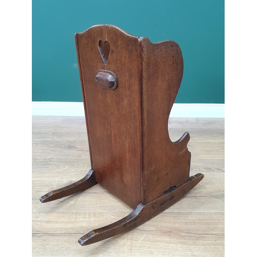 15 - An antique oak Childs Rocking Chair with pierced heart decoration.