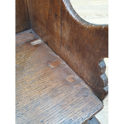 15 - An antique oak Childs Rocking Chair with pierced heart decoration.