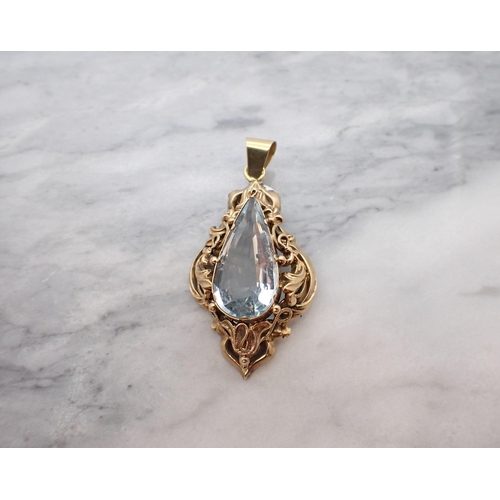 174 - An Aquamarine Pendant claw-set pear-cut stone within scrolled and pierced gold frame, approx 5cms lo... 