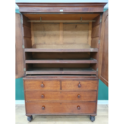 20 - A 19th Century flamed mahogany Linen Press, the top section with pair of panelled doors flanked by t... 