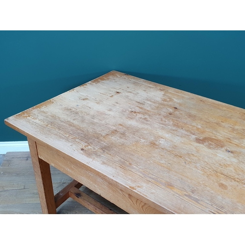 21 - A large Pine Kitchen Table on square supports and twin stretchers, 7ft Long x 3ft Wide x 2ft 6