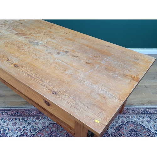 21 - A large Pine Kitchen Table on square supports and twin stretchers, 7ft Long x 3ft Wide x 2ft 6