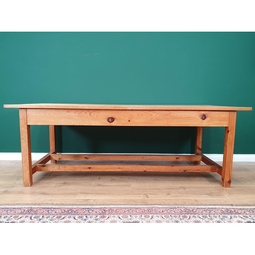 21 - A large Pine Kitchen Table on square supports and twin stretchers, 7ft Long x 3ft Wide x 2ft 6