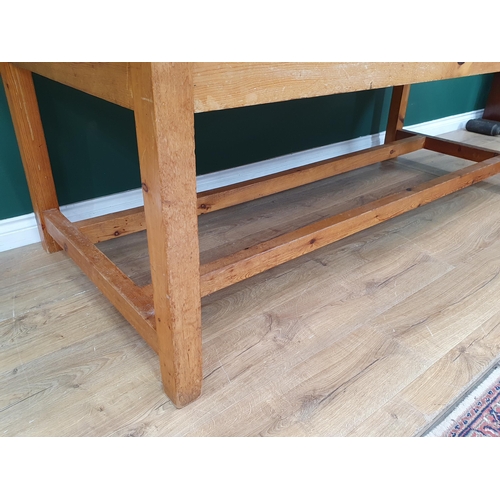 21 - A large Pine Kitchen Table on square supports and twin stretchers, 7ft Long x 3ft Wide x 2ft 6