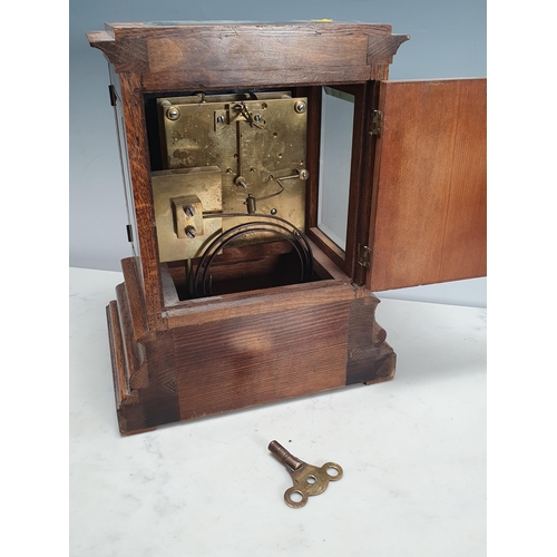 225 - An oak cased Mantel Clock, the silvered dial inscribed Benetfink & Co. Cheapside, 12in H