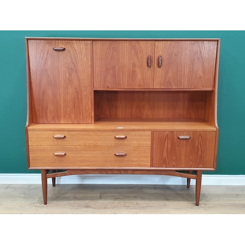 25 - A G-Plan Teak Sideboard, fitted pair of cupboard doors and a fall front compartment, above two fitte... 