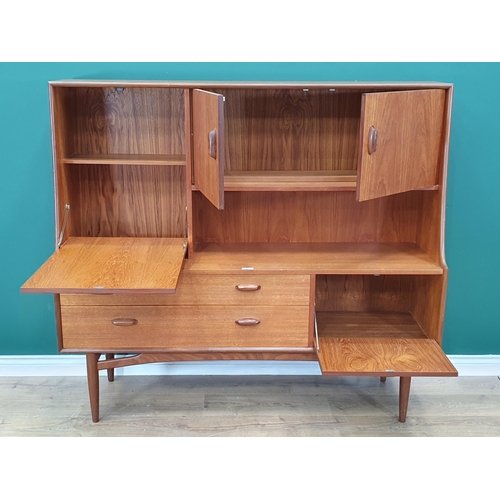 25 - A G-Plan Teak Sideboard, fitted pair of cupboard doors and a fall front compartment, above two fitte... 