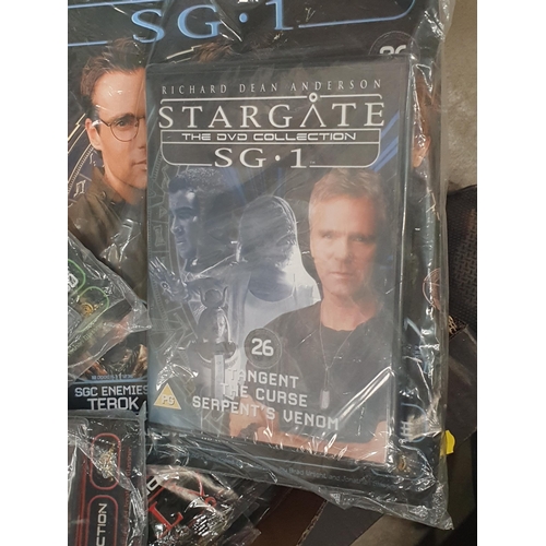 259 - A Box of Stargate DVD's and Magazines.