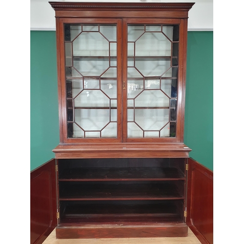 280 - A mahogany glazed top Bookcase, the dentil frieze cornice above pair of astragal glazed doors enclos... 