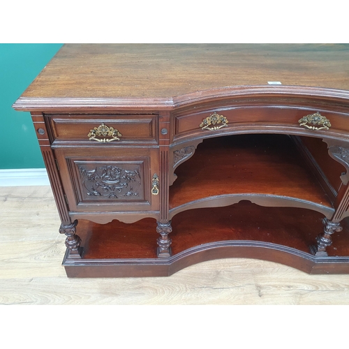 284 - A mahogany Sideboard fitted three drawers above open shelves and pair of leafage carved panel doors,... 