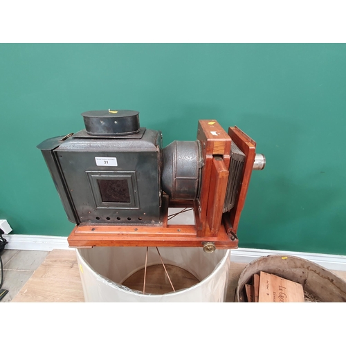 31 - A mahogany Plate Camera, a brass 