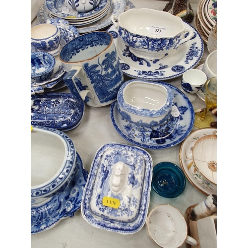 323 - A quantity of blue and white China including Plates, Mug, Sauce Tureens, etc, and various Plates, a ... 