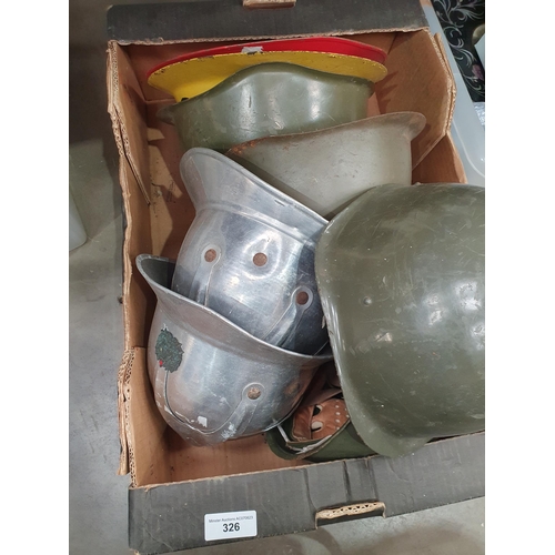 326 - A quantity of various military Helmets