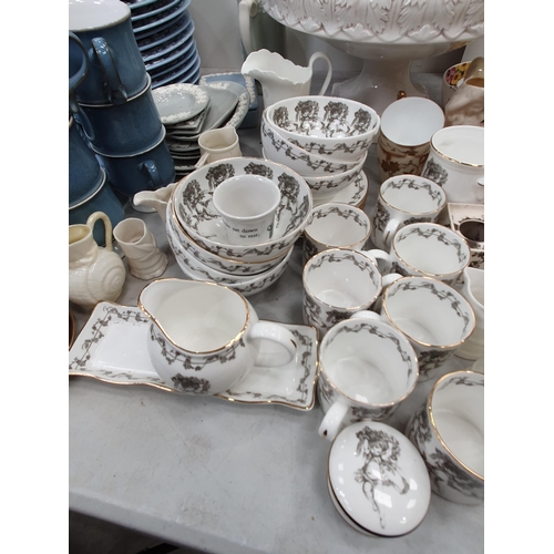 329 - A quantity of Wedgwood embossed Queensware dinnerware including Plates and Bowls, a Denby Coffee Ser... 