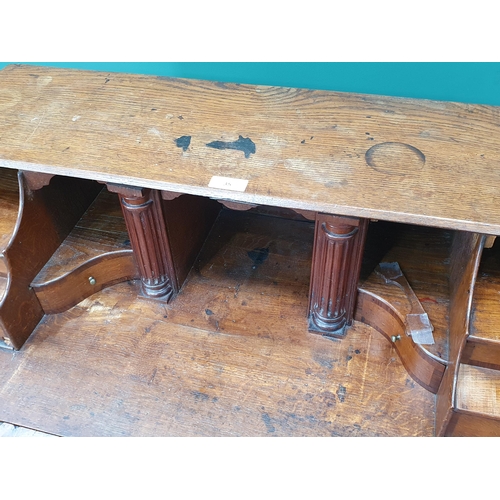 35 - An antique oak Bureau, the fall front with fitted interior above two short, three long drawers on br... 