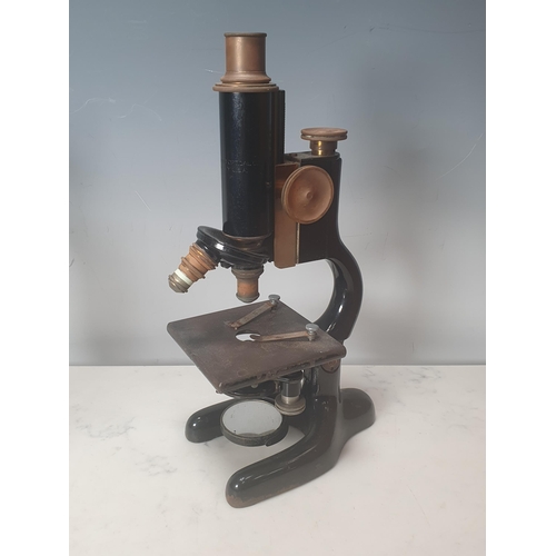 366 - A Bausch and Lomb Optical Company, New York Microscope in mahogany case and a pair of brass Figures ... 