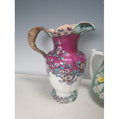 378 - A trio of green pottery Jugs with pewter lids decorated with oak leaves, and two Wedgewood style blu... 