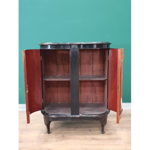 39 - An ebonised and walnut two door Cupboard, the inlaid doors enclosing shelved interior, raised on ebo... 