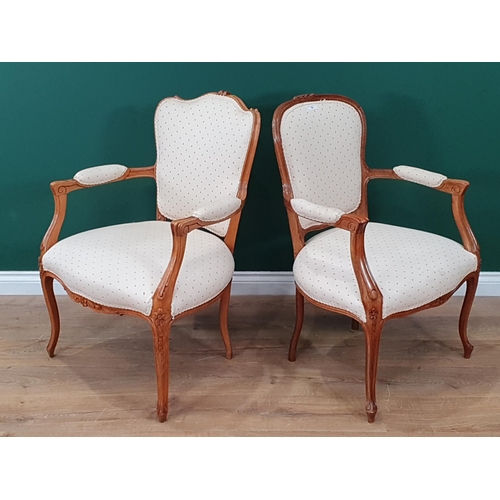 40 - Two cream upholstered French Style Elbow Chairs.